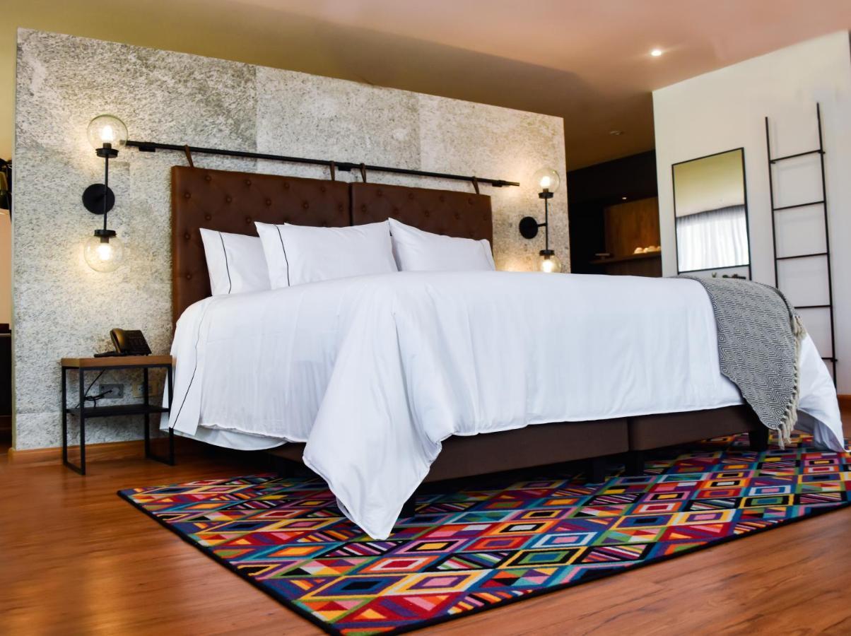 Hotel V1501 Pasto Exterior foto A bedroom with a carpet